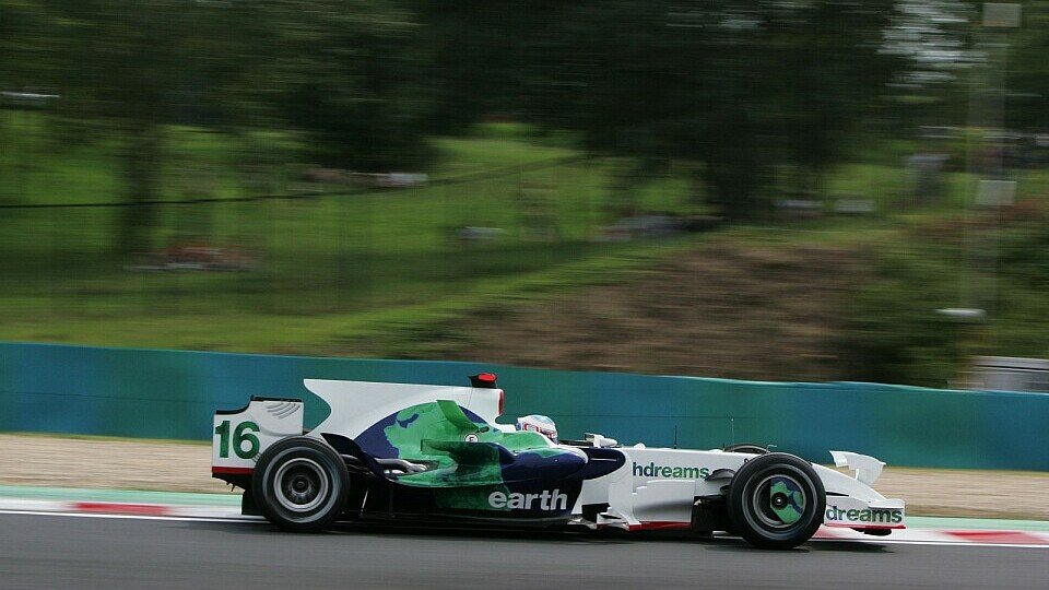 Jenson Button freute sich über P12., Foto: Sutton