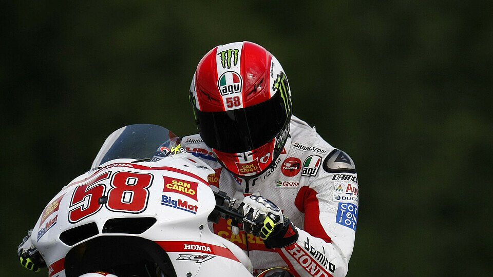 Marco Simoncelli freute sich über Platz drei wie über einen Sieg, Foto: Honda