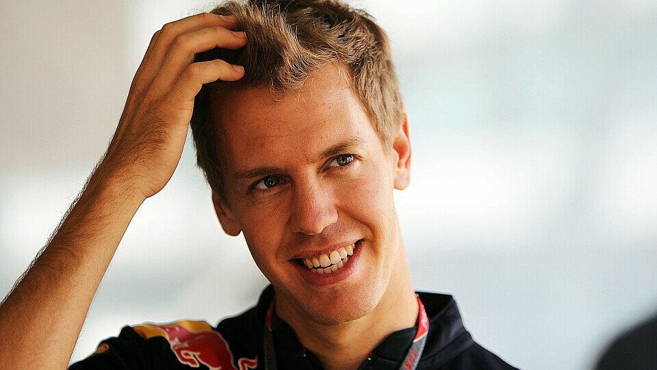 Sebastian Vettel hat die vorzeitige Titelverteidigung noch nicht vollends realisiert, Foto: Sutton