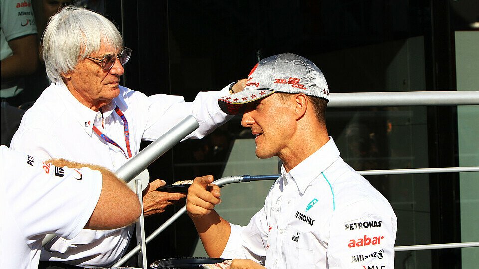 Michael Schumacher und Bernie Ecclestone bei der Feier zu Schumachers 300. Grand Prix in Spa 2012, Foto: Sutton