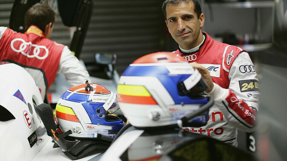 Marc Gené (rechts) in der Audi-Garage bei den 24 Stunden von Le Mans 2013, Foto: Audi